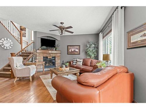 184 West Creek Landing, Chestermere, AB - Indoor Photo Showing Living Room With Fireplace