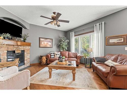 184 West Creek Landing, Chestermere, AB - Indoor Photo Showing Living Room With Fireplace