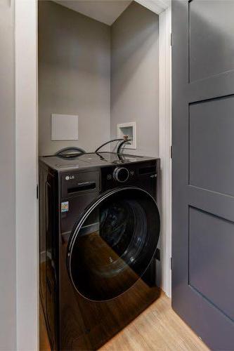 1-825 7Th Street North, Canmore, AB - Indoor Photo Showing Laundry Room