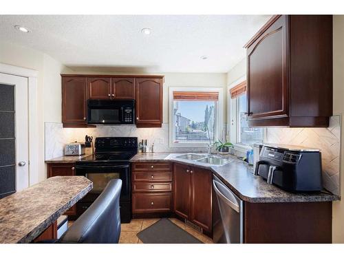 2033 Luxstone Link Sw, Airdrie, AB - Indoor Photo Showing Kitchen With Double Sink