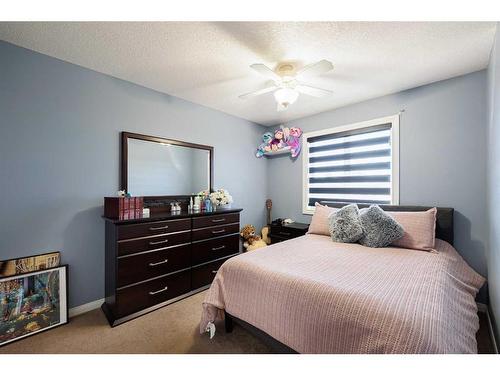 2033 Luxstone Link Sw, Airdrie, AB - Indoor Photo Showing Bedroom