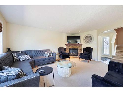 2033 Luxstone Link Sw, Airdrie, AB - Indoor Photo Showing Living Room With Fireplace