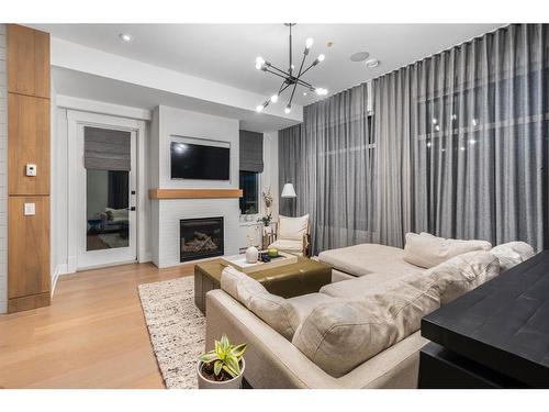 44 Spring Valley Sw, Calgary, AB - Indoor Photo Showing Living Room With Fireplace