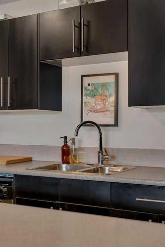 104-505 19 Avenue Sw, Calgary, AB - Indoor Photo Showing Kitchen With Double Sink