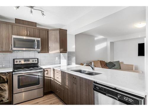 316 Windford Green Sw, Airdrie, AB - Indoor Photo Showing Kitchen With Double Sink