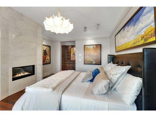 3209 5 Street Nw, Calgary, AB - Indoor Photo Showing Bedroom With Fireplace