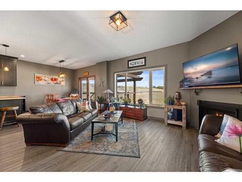 302 Valarosa Place, Didsbury, AB - Indoor Photo Showing Living Room With Fireplace