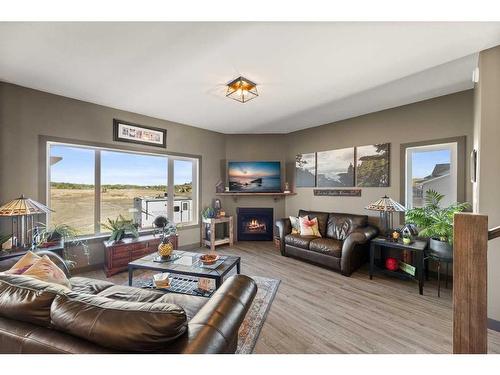 302 Valarosa Place, Didsbury, AB - Indoor Photo Showing Living Room With Fireplace