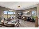 302 Valarosa Place, Didsbury, AB  - Indoor Photo Showing Living Room With Fireplace 