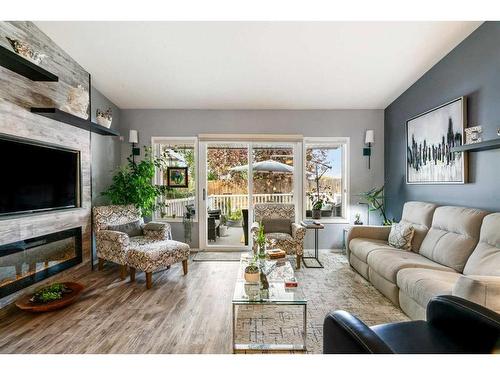 4B Centre Street, Strathmore, AB - Indoor Photo Showing Living Room With Fireplace