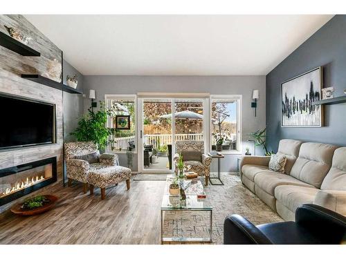 4B Centre Street, Strathmore, AB - Indoor Photo Showing Living Room With Fireplace