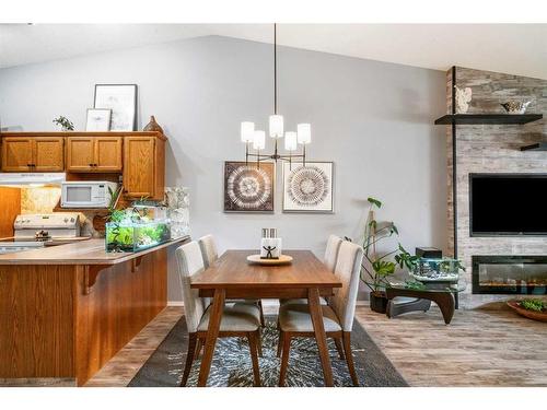 4B Centre Street, Strathmore, AB - Indoor Photo Showing Dining Room With Fireplace