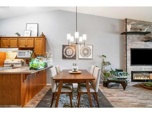 4B Centre Street, Strathmore, AB - Indoor Photo Showing Dining Room With Fireplace