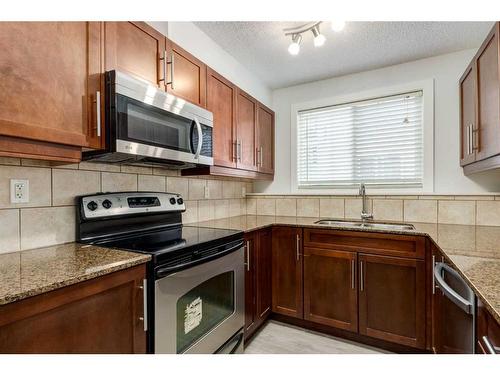 7-605 67 Avenue Sw, Calgary, AB - Indoor Photo Showing Kitchen With Stainless Steel Kitchen With Double Sink