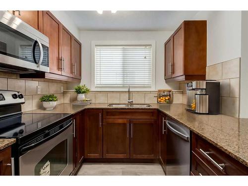 7-605 67 Avenue Sw, Calgary, AB - Indoor Photo Showing Kitchen With Double Sink