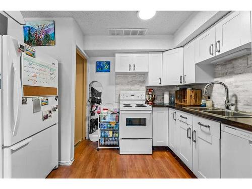 2-2804 17 Avenue Sw, Calgary, AB - Indoor Photo Showing Kitchen With Double Sink