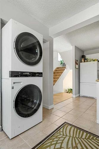 163 Woodvale Bay Sw, Calgary, AB - Indoor Photo Showing Laundry Room