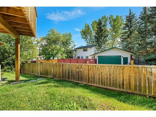 163 Woodvale Bay Sw, Calgary, AB - Outdoor With Backyard