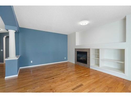 23 River Rock Place Se, Calgary, AB - Indoor Photo Showing Living Room With Fireplace