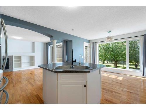 23 River Rock Place Se, Calgary, AB - Indoor Photo Showing Kitchen With Double Sink