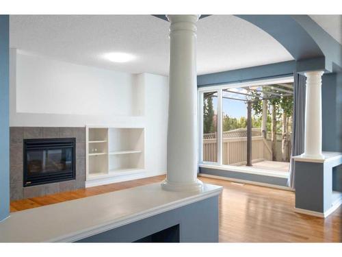 23 River Rock Place Se, Calgary, AB - Indoor Photo Showing Living Room With Fireplace