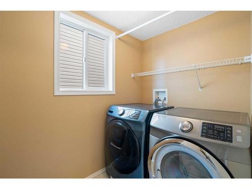 23 River Rock Place Se, Calgary, AB - Indoor Photo Showing Laundry Room