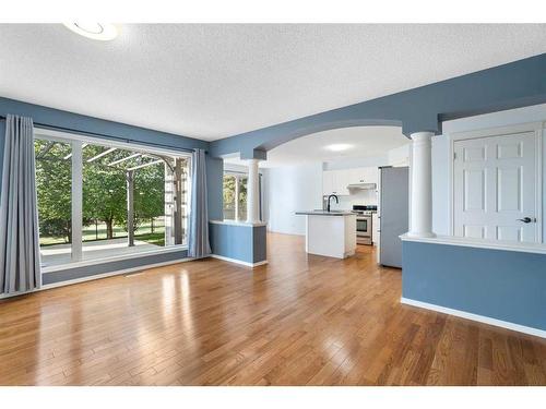 23 River Rock Place Se, Calgary, AB - Indoor Photo Showing Living Room