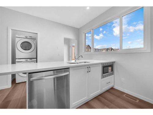 160 Setonstone Manor Se, Calgary, AB - Indoor Photo Showing Kitchen With Double Sink