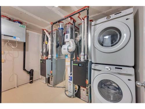 160 Setonstone Manor Se, Calgary, AB - Indoor Photo Showing Laundry Room