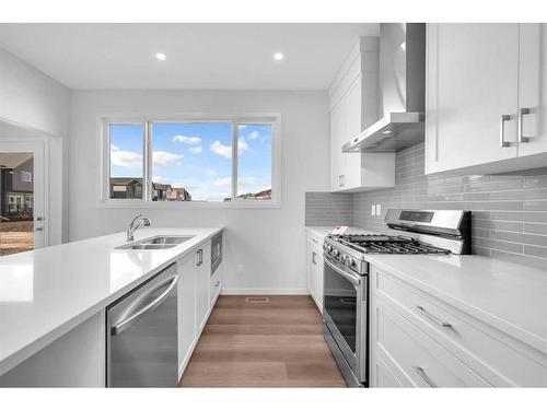 160 Setonstone Manor Se, Calgary, AB - Indoor Photo Showing Kitchen With Double Sink With Upgraded Kitchen