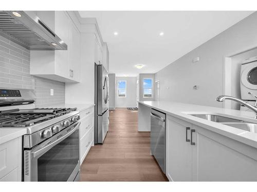 160 Setonstone Manor Se, Calgary, AB - Indoor Photo Showing Kitchen With Double Sink With Upgraded Kitchen