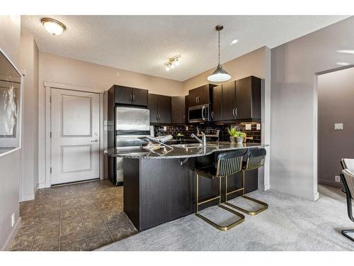 4504-5605 Henwood Street Sw, Calgary, AB - Indoor Photo Showing Kitchen With Double Sink