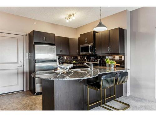 4504-5605 Henwood Street Sw, Calgary, AB - Indoor Photo Showing Kitchen With Double Sink