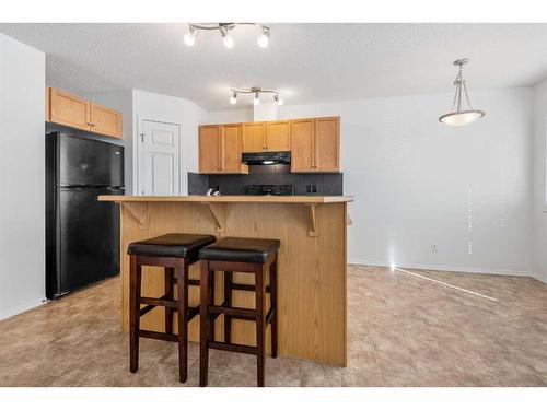 102-800 Yankee Valley Boulevard Se, Airdrie, AB - Indoor Photo Showing Kitchen