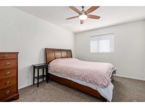 102-800 Yankee Valley Boulevard Se, Airdrie, AB - Indoor Photo Showing Bedroom