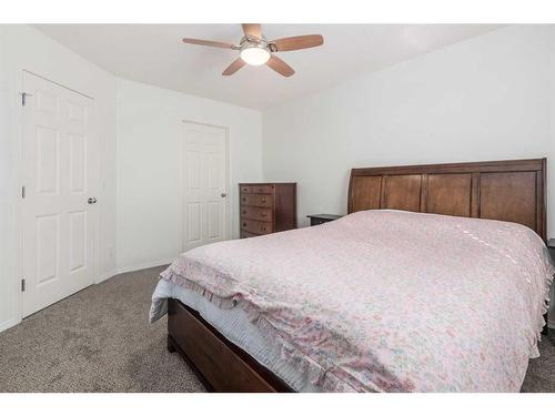 102-800 Yankee Valley Boulevard Se, Airdrie, AB - Indoor Photo Showing Bedroom