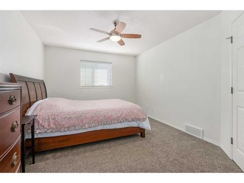 102-800 Yankee Valley Boulevard Se, Airdrie, AB - Indoor Photo Showing Bedroom