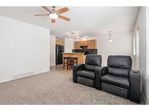 102-800 Yankee Valley Boulevard Se, Airdrie, AB - Indoor Photo Showing Living Room