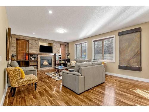 161 Stonemere Close, Chestermere, AB - Indoor Photo Showing Living Room With Fireplace