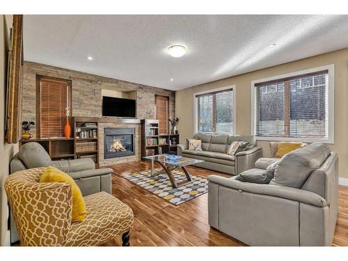 161 Stonemere Close, Chestermere, AB - Indoor Photo Showing Living Room With Fireplace