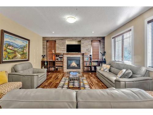 161 Stonemere Close, Chestermere, AB - Indoor Photo Showing Living Room With Fireplace