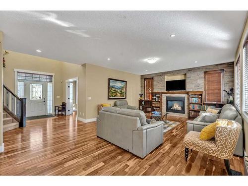 161 Stonemere Close, Chestermere, AB - Indoor Photo Showing Living Room With Fireplace