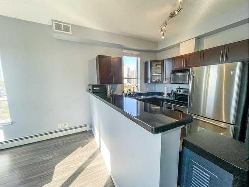 1001-1053 10 Street Sw, Calgary, AB - Indoor Photo Showing Kitchen With Stainless Steel Kitchen