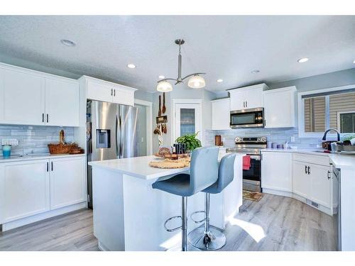 1715 Baywater View Sw, Airdrie, AB - Indoor Photo Showing Kitchen With Stainless Steel Kitchen With Upgraded Kitchen