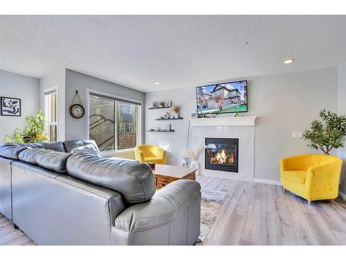 1715 Baywater View Sw, Airdrie, AB - Indoor Photo Showing Living Room With Fireplace