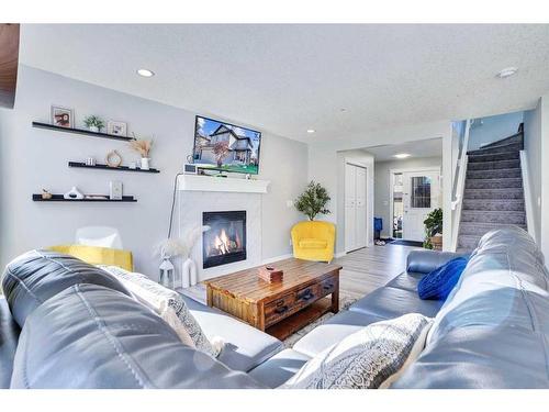 1715 Baywater View Sw, Airdrie, AB - Indoor Photo Showing Living Room With Fireplace