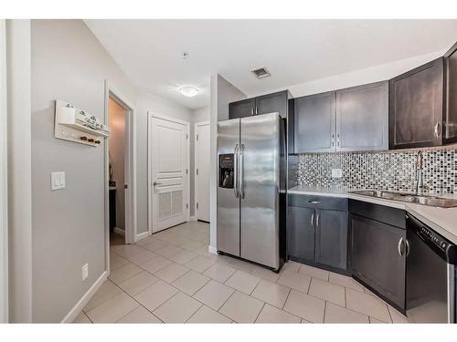 306-1320 1 Street Se, Calgary, AB - Indoor Photo Showing Kitchen With Double Sink