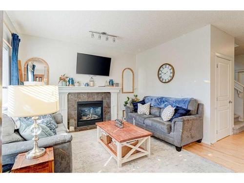 71 Copperfield Point Se, Calgary, AB - Indoor Photo Showing Living Room With Fireplace