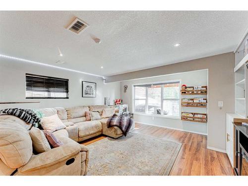 71 Copperfield Point Se, Calgary, AB - Indoor Photo Showing Living Room With Fireplace