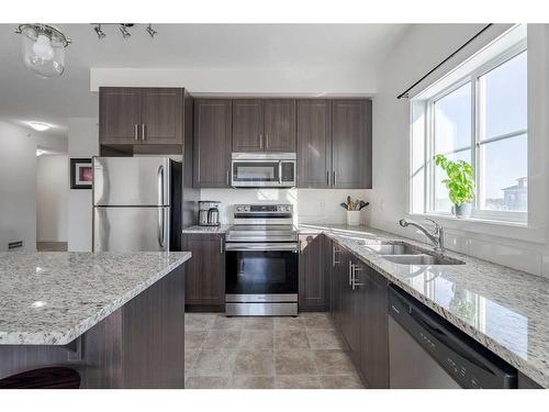 4418-99 Copperstone Park Se, Calgary, AB - Indoor Photo Showing Kitchen With Double Sink With Upgraded Kitchen